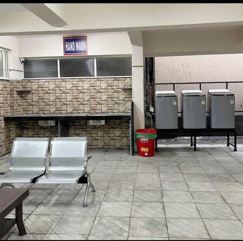 Free washing machine area for PG residents at Srinivasa PG Pune